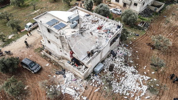 An aerial view of wreckage around the site after an operation carried out by US forces with the support of an F-16 fighter jet and a helicopter today in Idlib, Syria