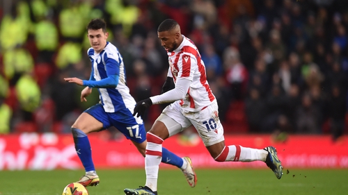 Jamie McGrath (L) keeps pace with Stoke City's Tyrese Campbell