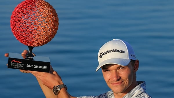 Nicolai Hojgaard of Denmark poses with the trophy after his win