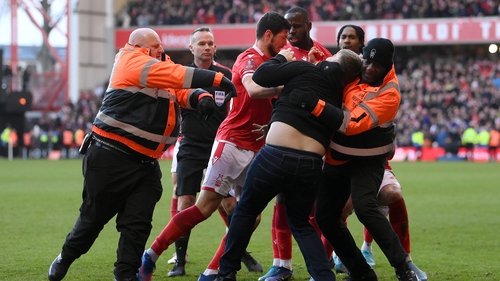 The man confronted celebrating Nottingham Forest players