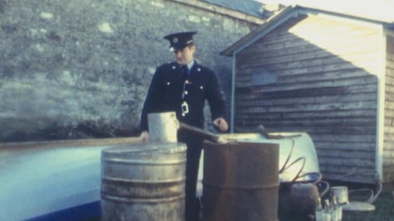 Garda with poteen still, Headford, County Galway (1982)