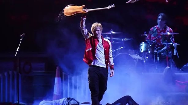 Ed Sheeran rocks a varsity jacket at the Brit Awards 2022 (Ian West/PA)