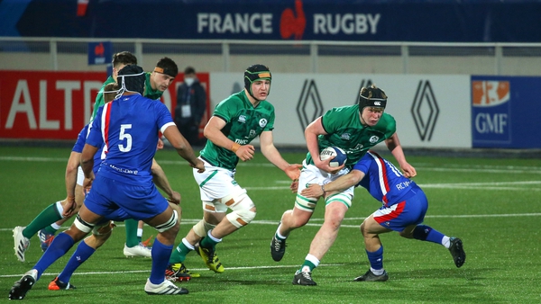 Conor O Tighearnaigh attempts to break clear of the French cover
