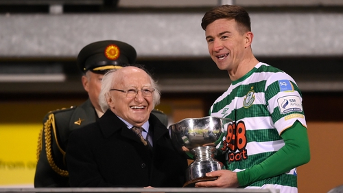Ronan Finn accepts the President's Cup from Michael D Higgins