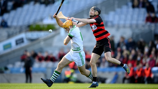 Colin Fennelly of Shamrocks in action against Ballygunner's Barry Coughlan.