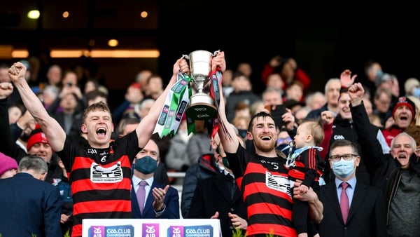 Ballygunner's Philip O'Mahony (L) and Barry Coughlan lift the Tommy Moore Cup.