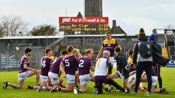 Wexford players stretch after victory at Ennis