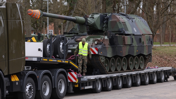 A German soldier prepares a military vehicle for transport to Lithuania today