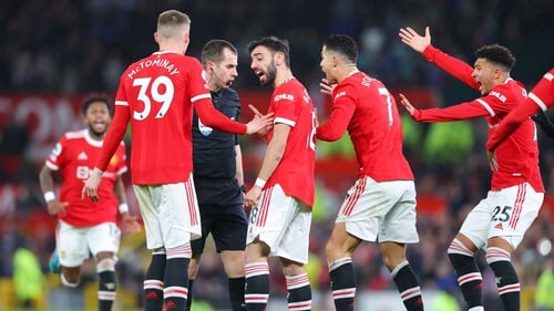 Man United players argue with referee Peter Bankes during the 2-0 Premier League win over Brighton