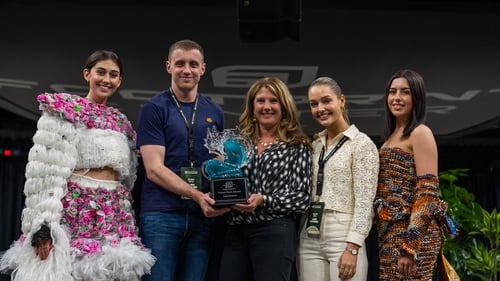 Rory Kelly accepts the Ocean Hero award won by Junk Kouture at the Footprint Sustainability Summit in Phoenix, Arizona