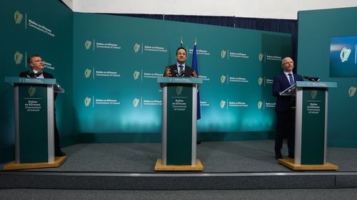 Michael McGrath (L) and Stephen Donnelly flank Tánaiste Leo Varadkar at a press briefing last month