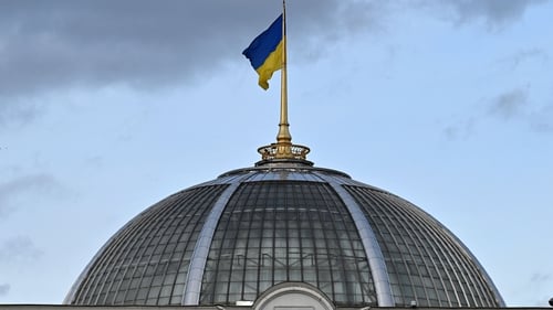 Ukraine flag over the parliament building in Kyiv. Photo: Getty Images