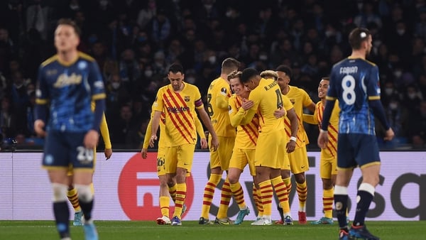 Barcelona players celebrate Frenkie De Jong's goal against Napoli