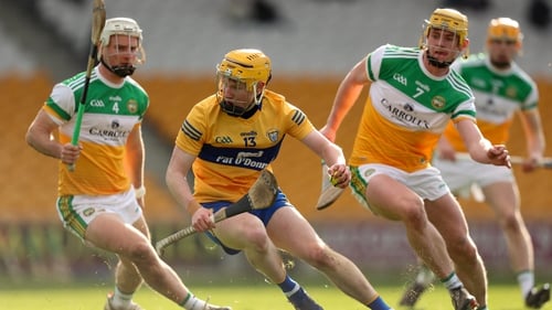 Shane Meehan of Clare in action against Paddy Delaney (L) and Killian Sampson.