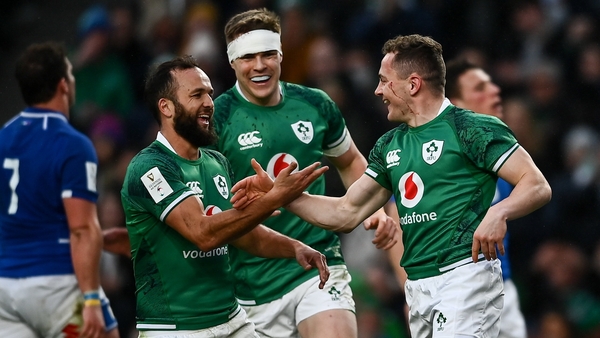 Jamison Gibson-Park and Garry Ringrose congratulate Michael Lowry on the first of his two tries