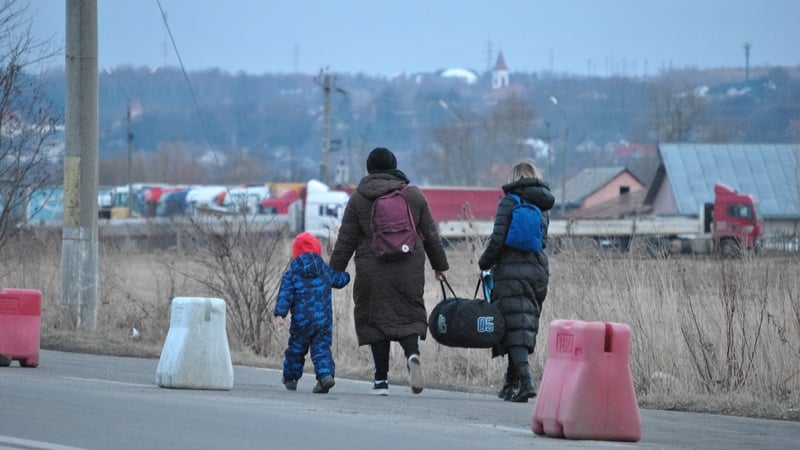 Ukrainians cross the border with Romania after fleeing their homes