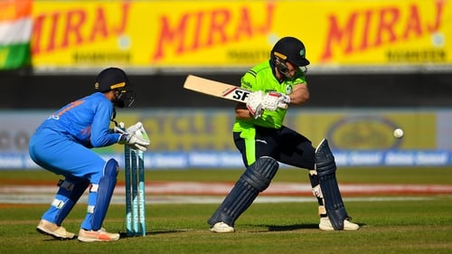 Gary Wilson of Ireland and Dinesh Karthik of India in action during the T20 International match in 2018