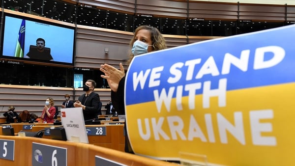 Members of the European Parliament applaud Ukrainian President Volodymyr Zelensky