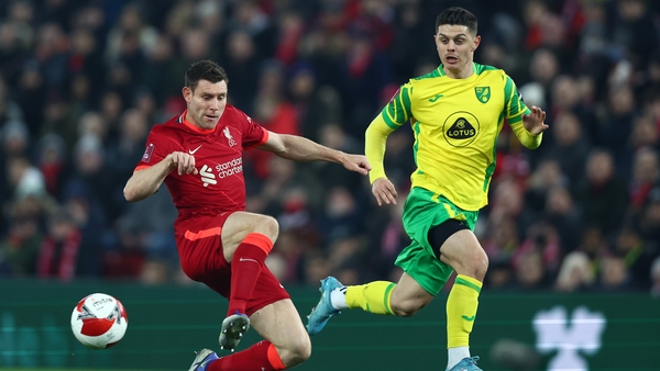 James Milner battles for possession with Milot Rashica.