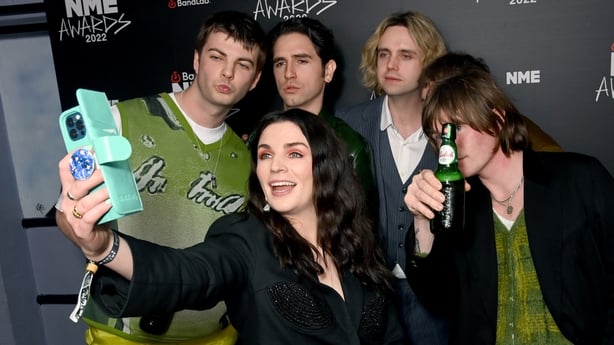 Aisling Bea, Tom Coll, Grian Chatten, Carlos O'Connell, Conor Deegan and Conor Curley of Fontaines D.C in the Winners Room during the NME Awards 2022 at O2 Academy Brixton on March 02, 2022 in London, England. (Photo by Dave J Hogan/Getty Images)