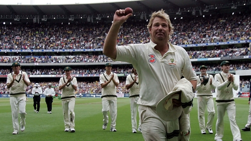 Shane Warne is applauded off the pitch by his Australian teammates during The Ashes series of 2006-2007