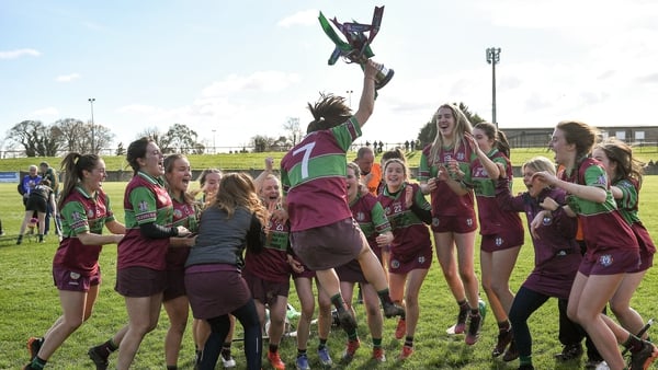 Eoghan Rua players celebrate with the trophy