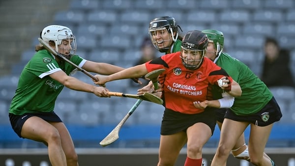 Ursula Jacob of Oulart the Ballagh is tackled by Sarsfields players, from left, Joanne Daly, Laura Ward, and Kate Gallagher