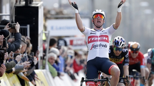 Mads Pedersen celebrates at the finish line.