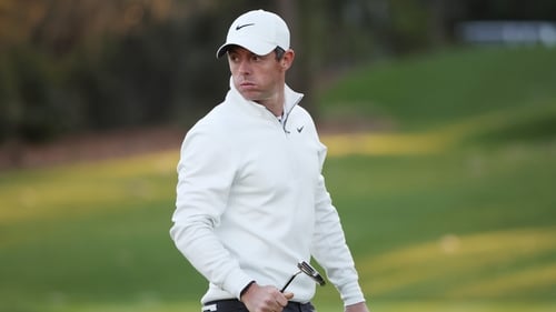 McIlroy reacts on the eighth green during his second round