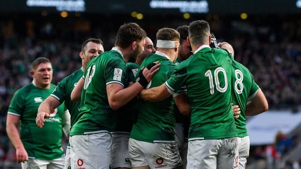 Hugo Keenan is surrounded by team-mates after scoring Ireland's second try against England