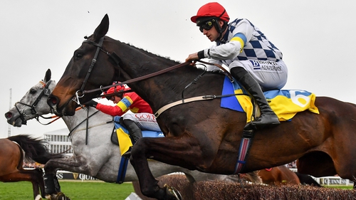 Stattler, with Patrick Mullins up, jumps the last during the first circuit on their way to winning the Ukraine Appeal National Hunt Challenge Cup Amateur Jockeys' Novices' Chase