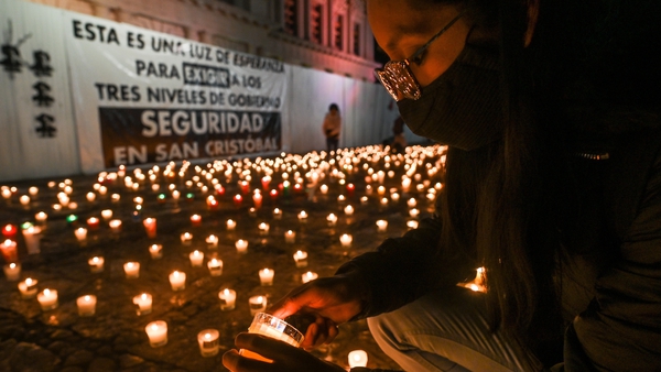 A journalist lights a candle at a vigil following a meeting of journalists in San Cristobal de las Casas earlier this month