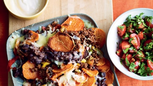 Tuck into slices of sweet potato loaded with veggie mince, beans, cheese and salsa.