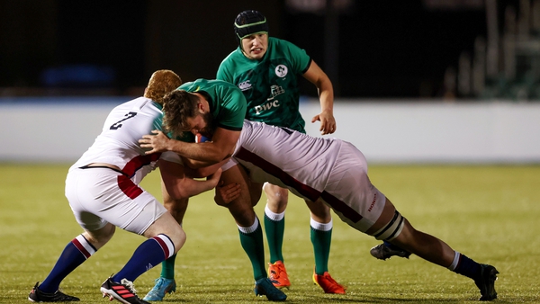 Ben Carson is tackled by two English players during last week's win against England