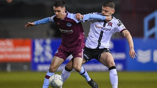 Drogheda goalscorer Dean Williams tries to evade the advances of Andy Boyle