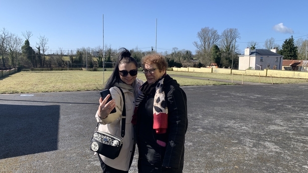 Darina Yanchuk and Margaret Kerrigan take a selfie outside the school
