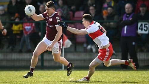Johnny Heaney of Galway in action against Derry's Gareth McKinless