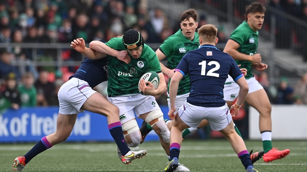 James Culhane of Ireland is tackled by Christian Townsend of Scotland