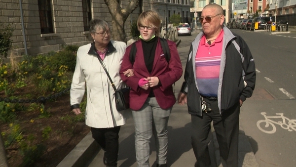 Ashleigh Carroll, pictured outside the court with her grandparents, was thrown violently into the air and struck her head on the ground, causing a significant head injury