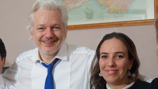 Julian Assange pictured with his wife Stella Moris