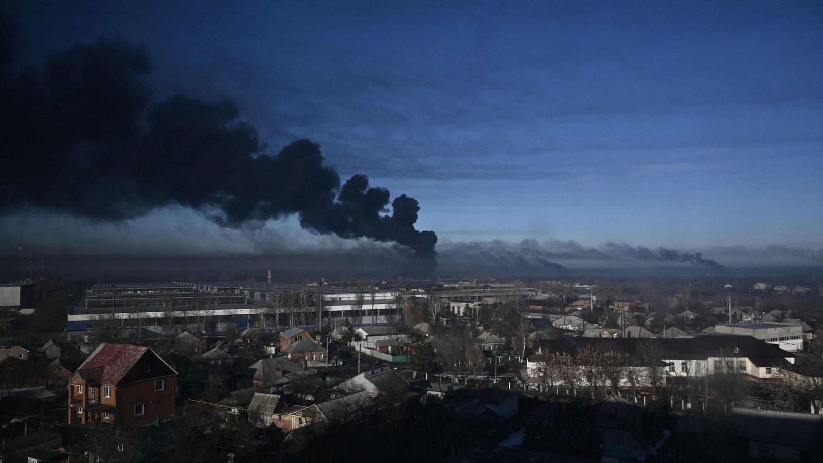 Image - Black smoke rises from a military airport in Chuguyev near Kharkiv on 24 February