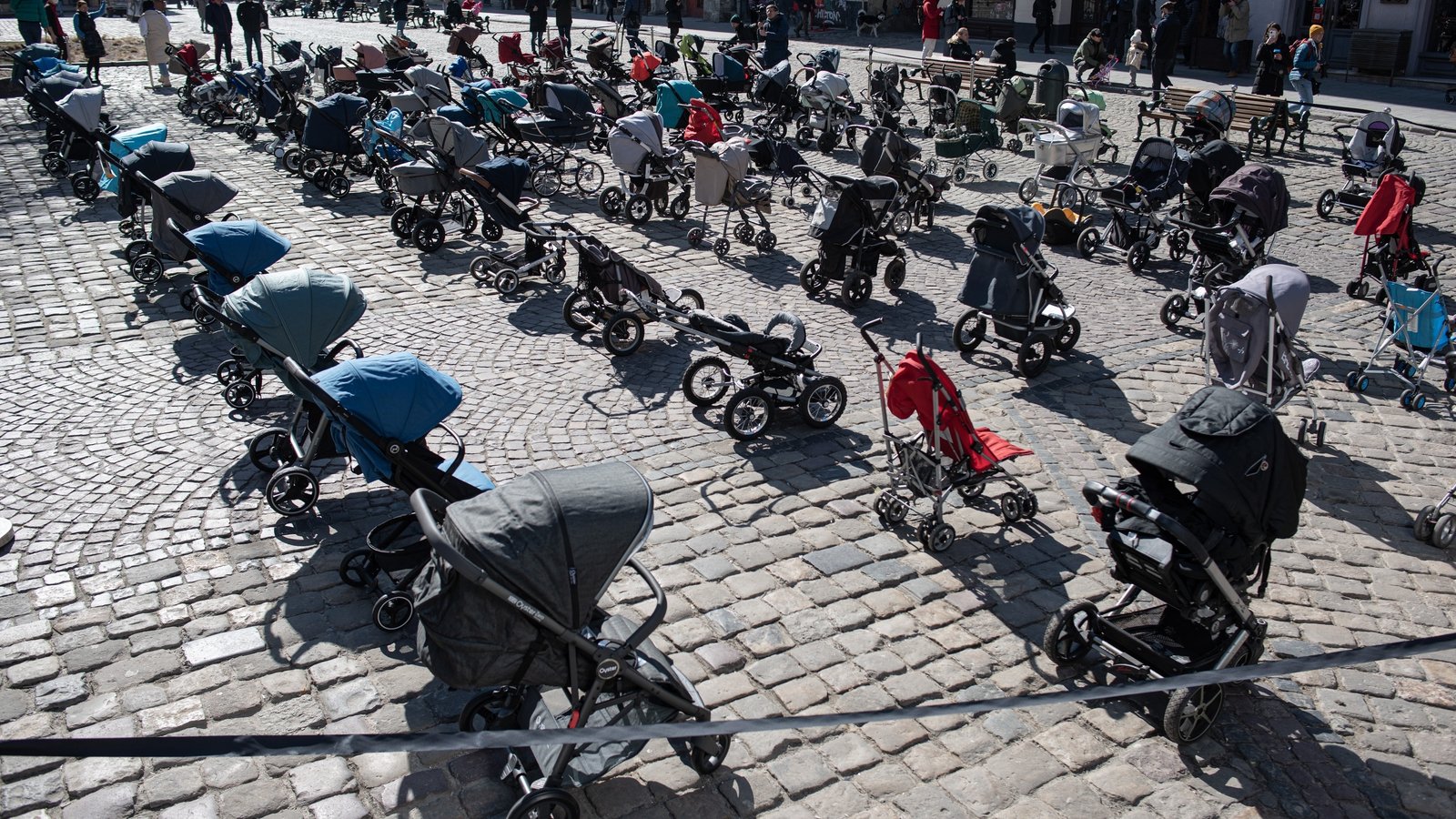 Image - Empty prams placed outside the Lviv city council to highlight the number of children being killed in the invasion