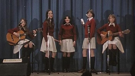 Group of schoolgirls performing at finals of Slógadh (1977)