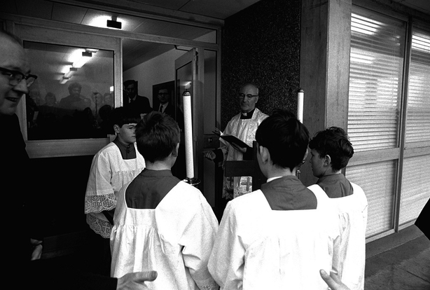 Fr Tomás Ó Concheannain and four altar boys, about to enter the headquarters of RTÉ Raidió na Gaeltachta, to celebrate a mass at the opening of the station on Easter Sunday 1972.  1024_082_rnag