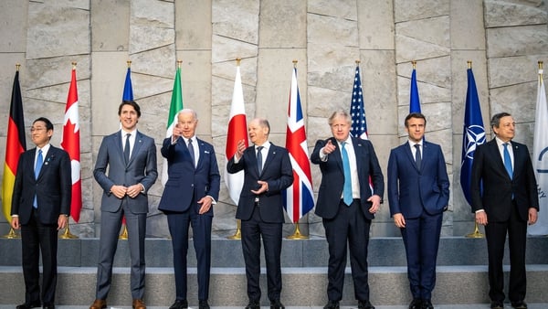 Fumio Kishida, Justin Trudeau, Joe Biden, Olaf Scholz, Boris Johnson, Emmanuel Macron and Mario Draghi pose for a G7 leaders' family photo during a NATO summit today