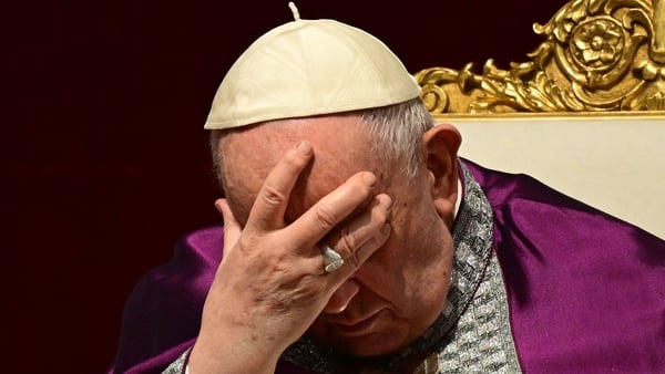 Pope Francis bows his head at the service at St Peter's Basilica today