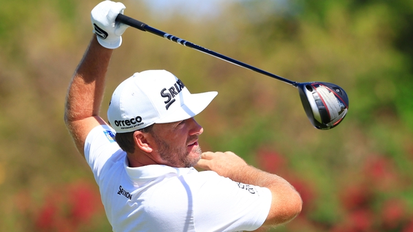 Graeme McDowell plays his shot from the 12th tee during the third round