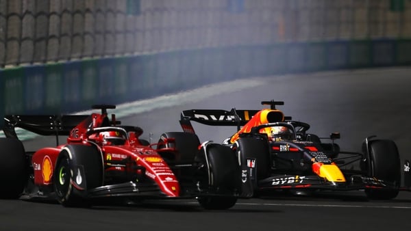 Max Verstappen of the Netherlands driving the (1) Oracle Red Bull Racing RB18 and Charles Leclerc of Monaco driving (16) the Ferrari F1-75 battle for track position