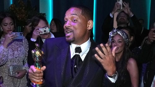 Will Smith holding his Best Actor Oscar at the Vanity Fair after party