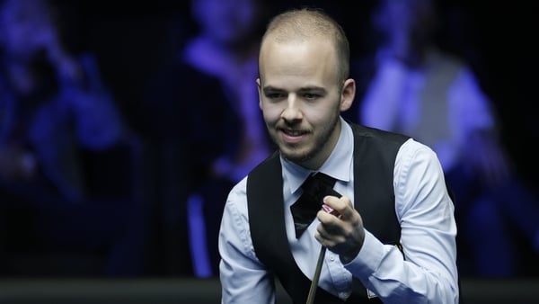 Luca Brecel will face John Higgins on Saturday for a place in the final